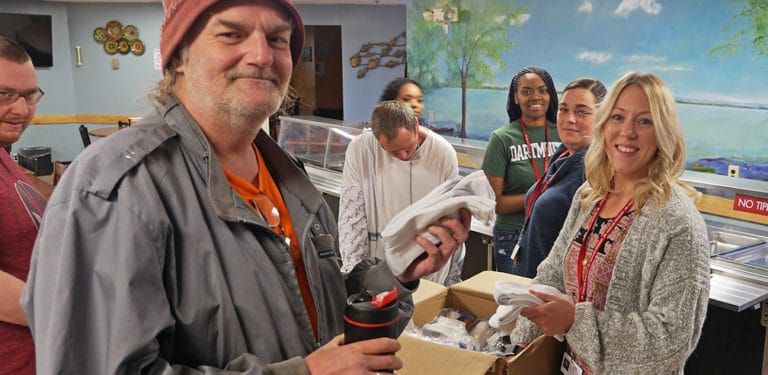 A group of staff and patrons at the Rescue Mission